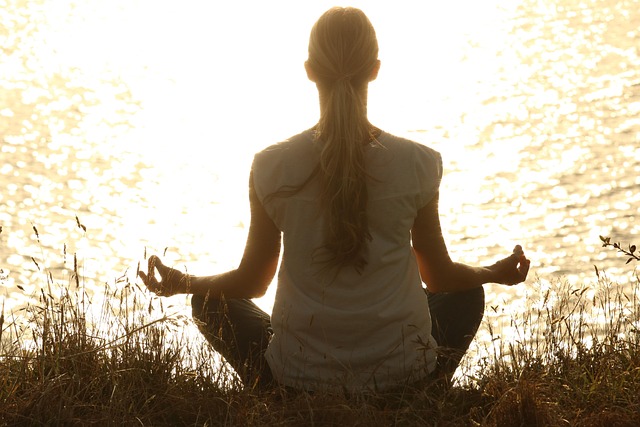 A serene image of someone practicing vibrant yoga poses outdoors, representing a wellness journey.